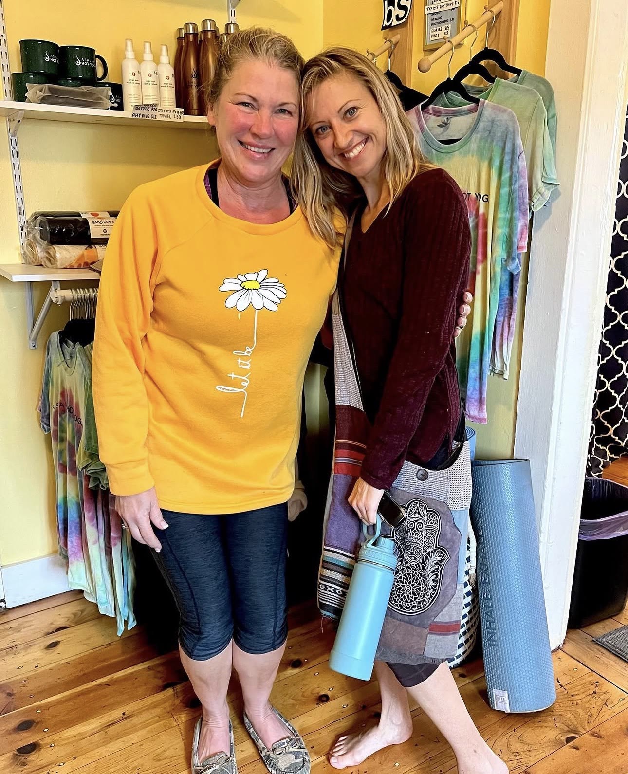 Two friends smiling in the studio boutique