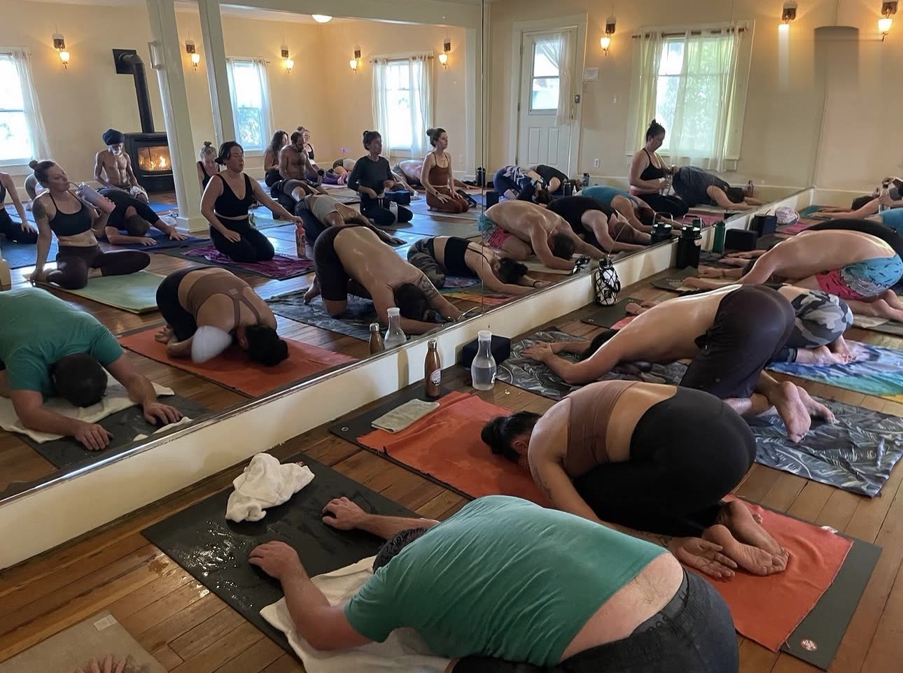 A full room folding into child's pose