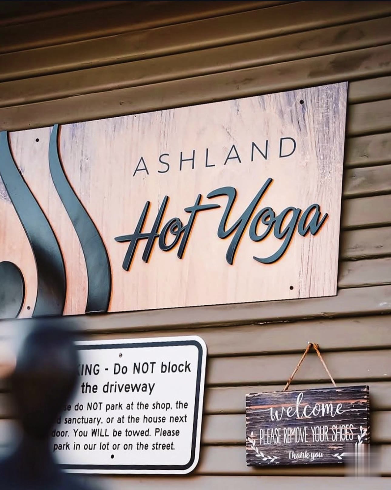 The studio sign and welcome board at the front door