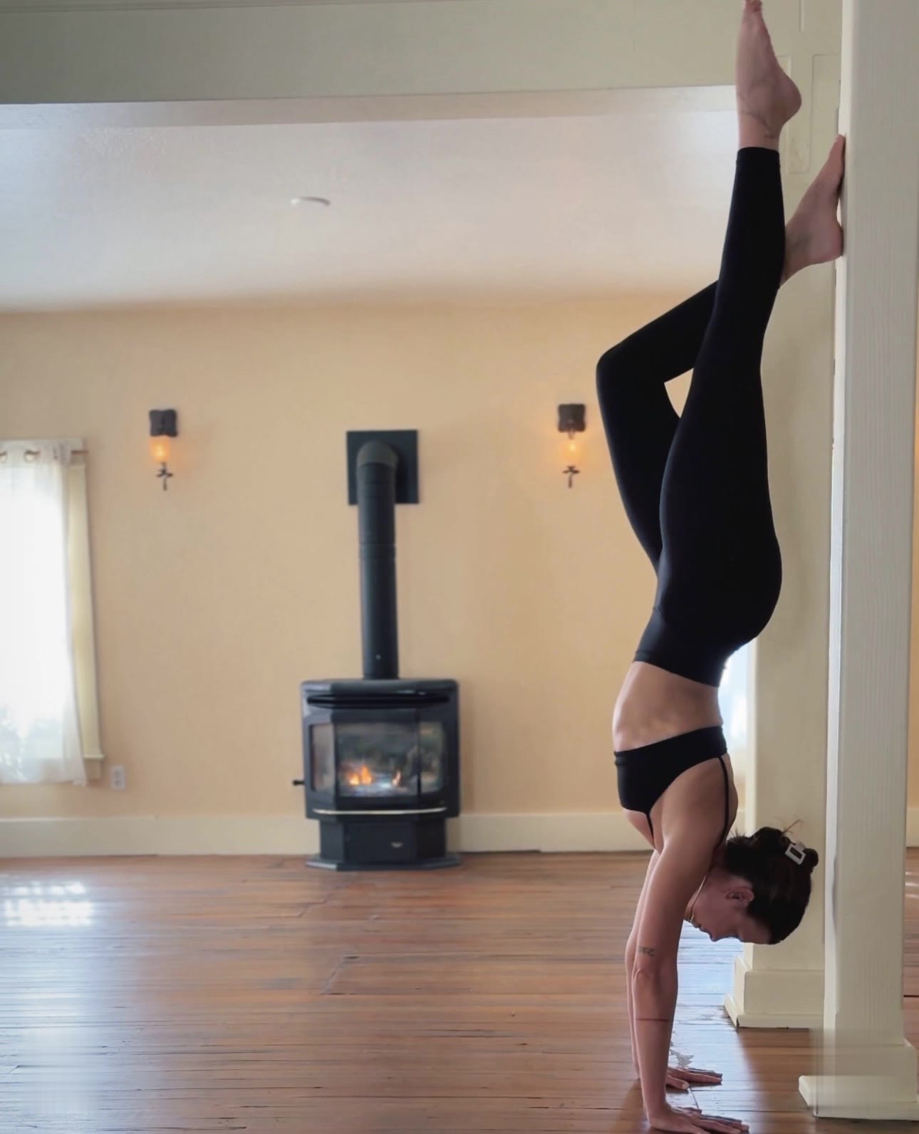 A handstand by the fireplace