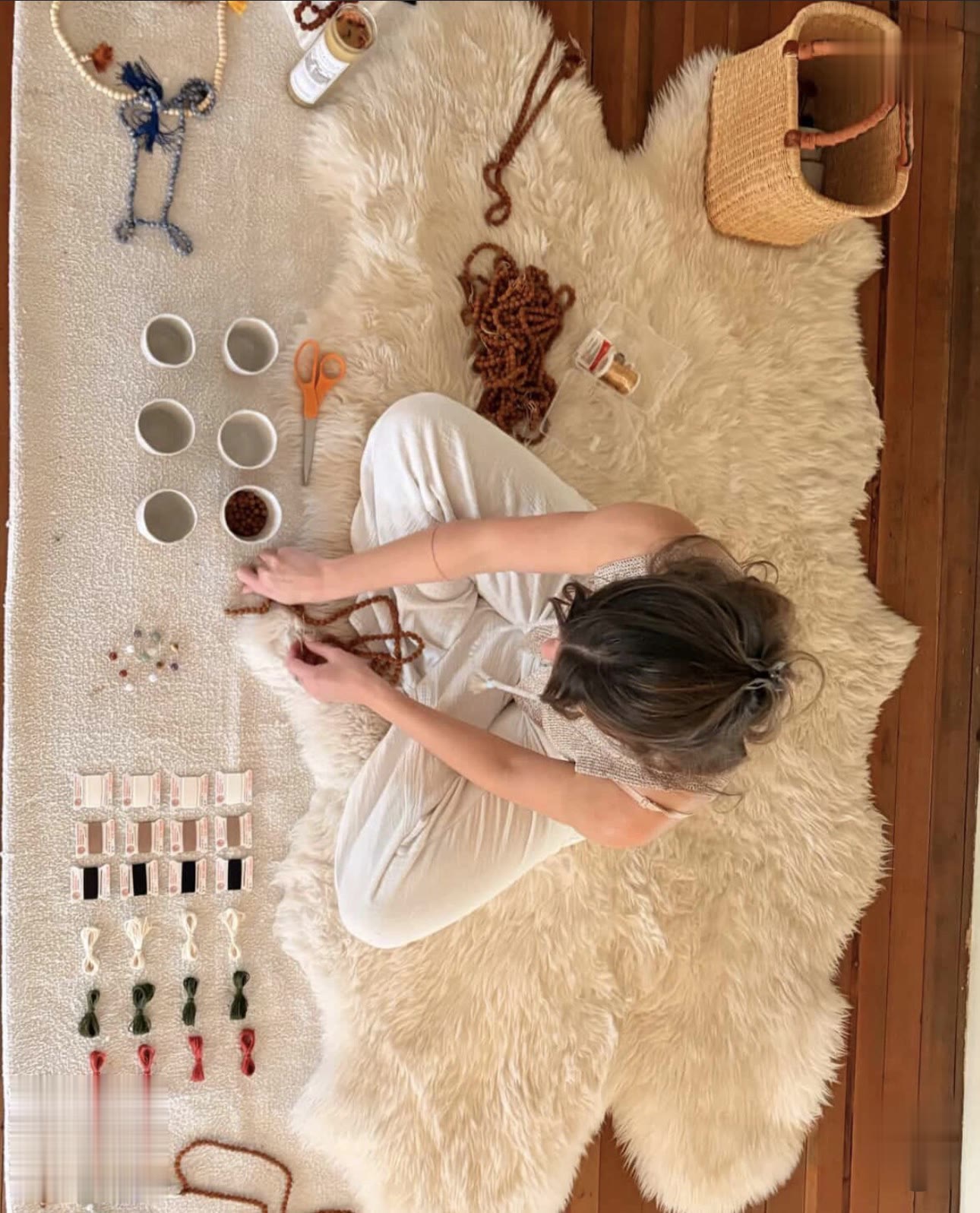 Mala making in progress on the fur rug