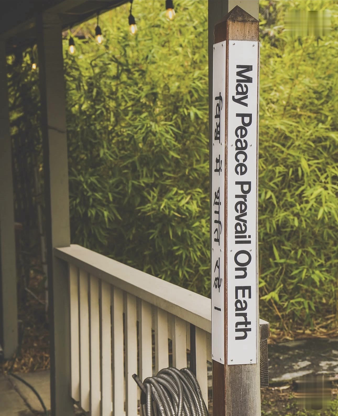 May Peace Prevail On Earth - the peace pole by the porch