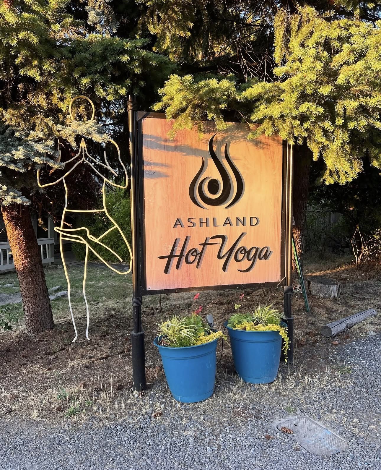 The Ashland Hot Yoga sign in golden evening light