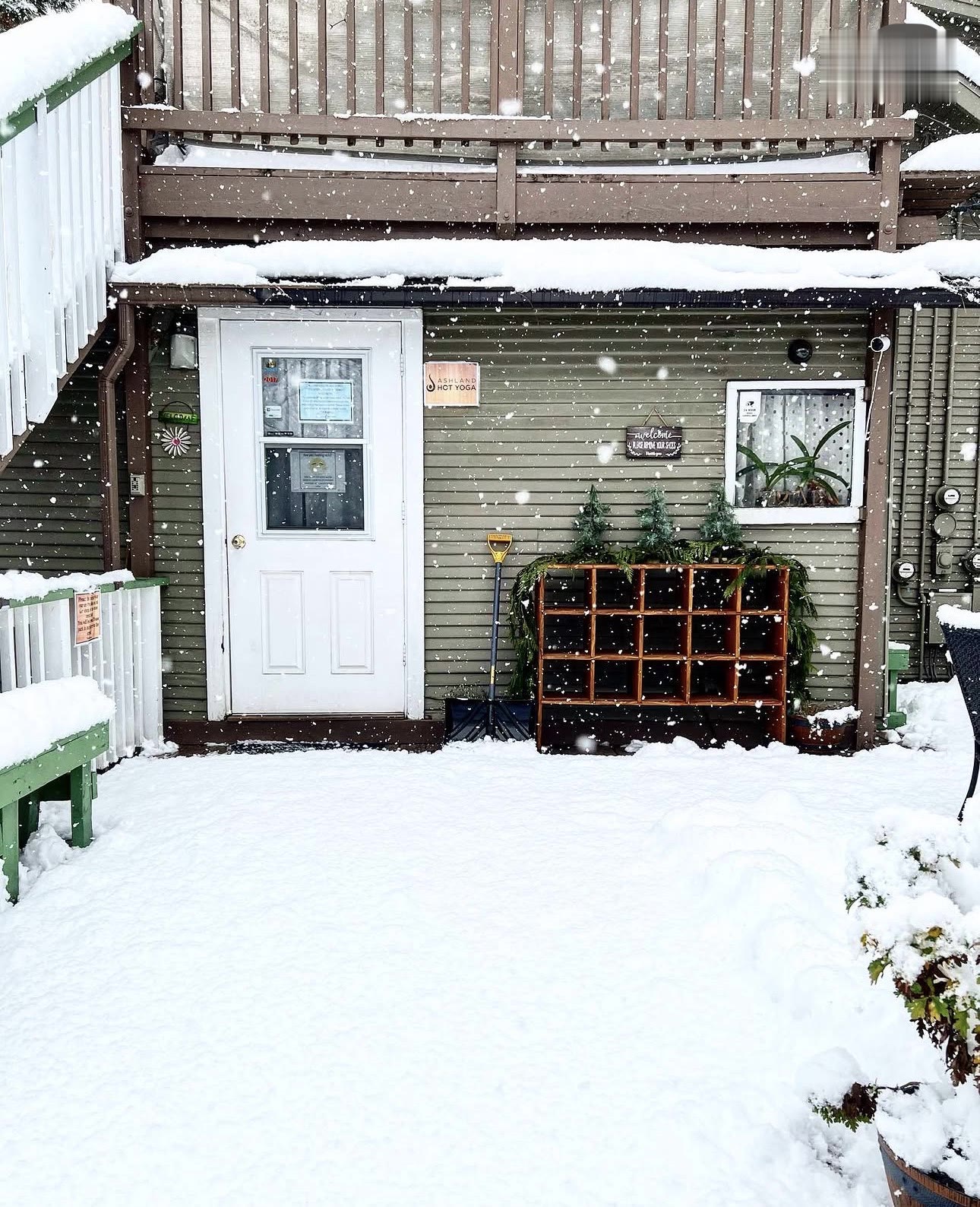 The entrance dressed in snow and evergreens