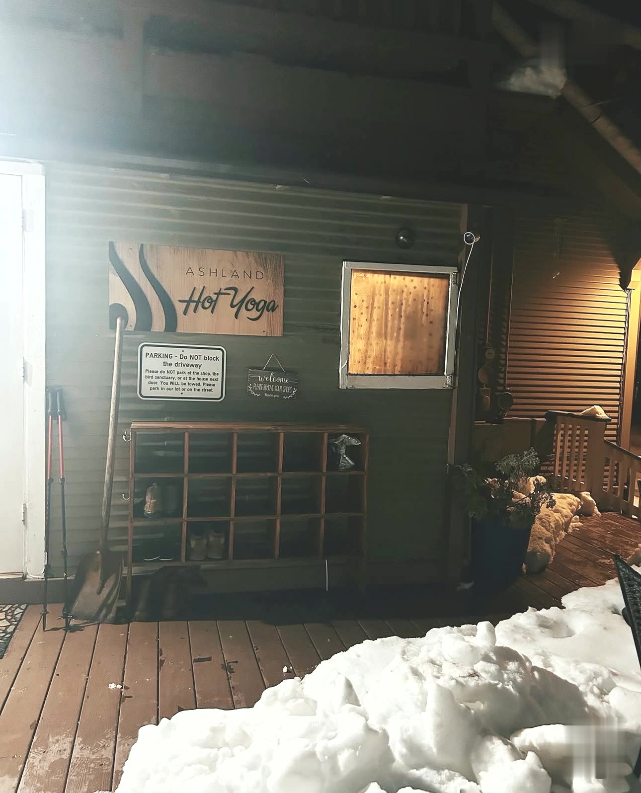 The studio entrance glowing on a snowy night